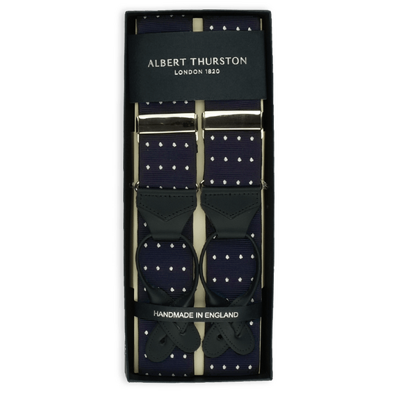 Zusammengelegter Hosentr�ger von Albert Thurston in Dunkelblau mit wei�en Punkten und dunkelblauen Leder-Laschen.