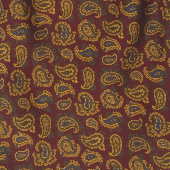 Detailansicht einer bedruckten Seide mit Paisley-Muster in Gold-Dunkelgr�n-Dunkelblau auf Braun
